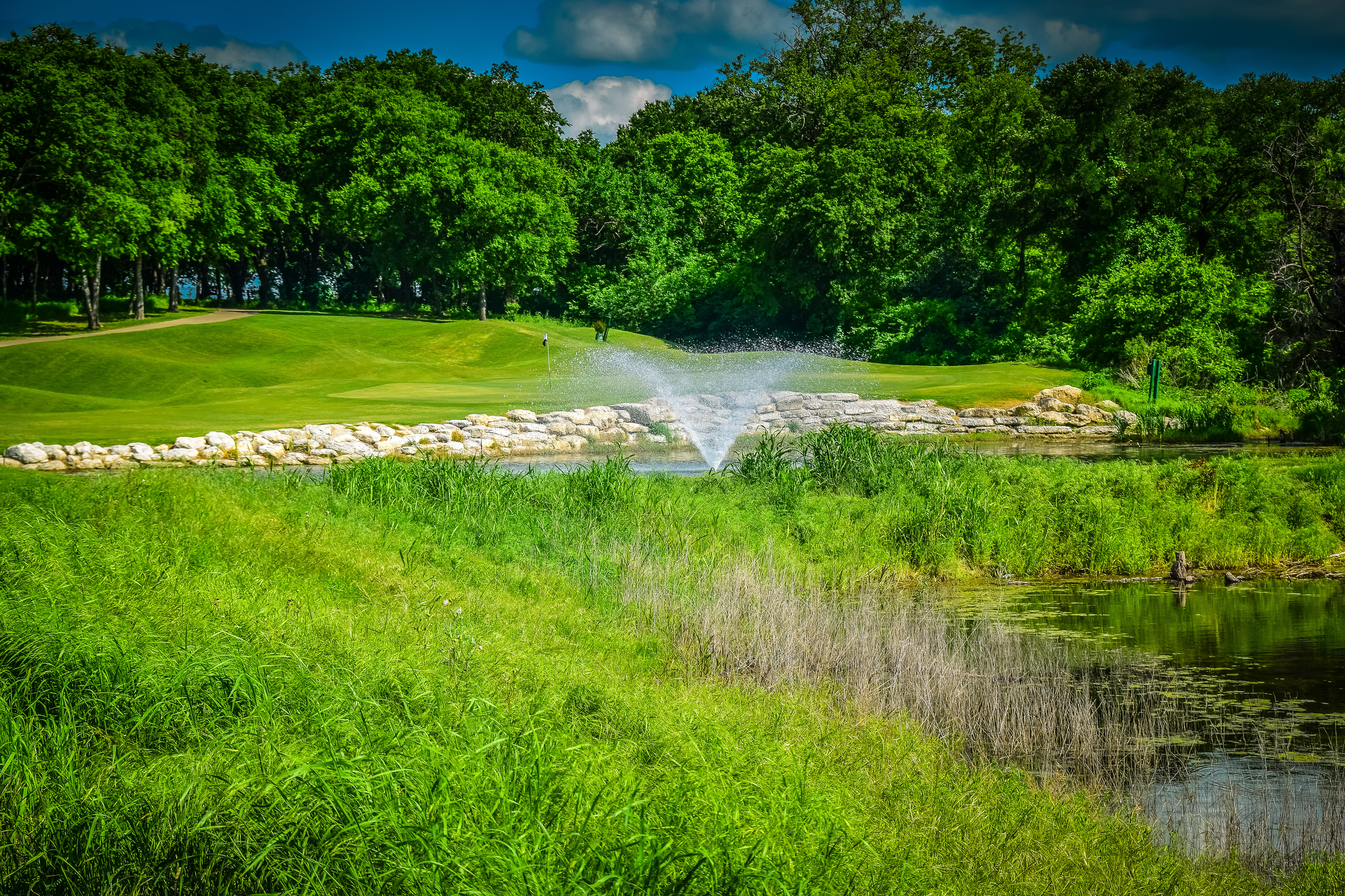 Signature par-4 14th hole with elevation changes